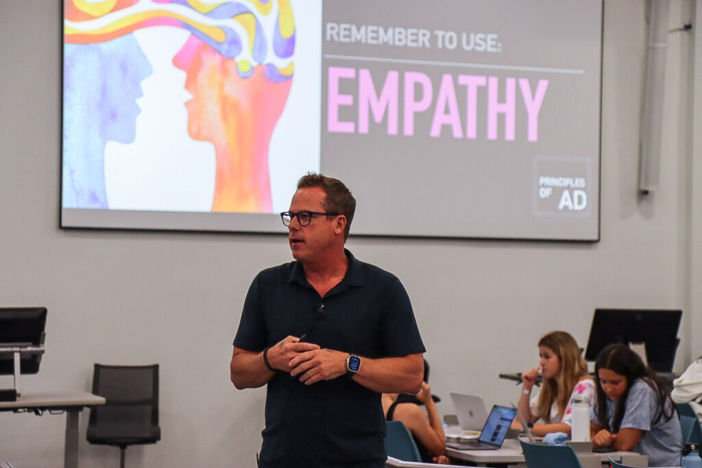a man teaches an advertising class