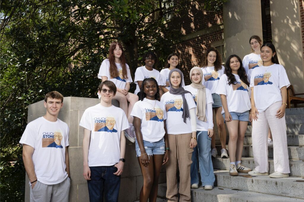 a group of students wearing matching "Chuck Stone Program" shirts