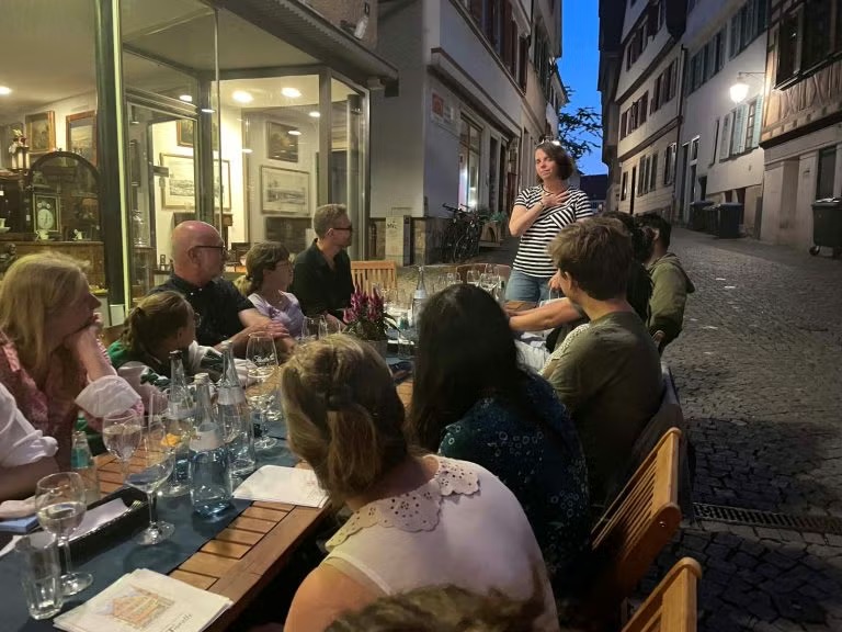 people eating dinner at a restaurant in europe