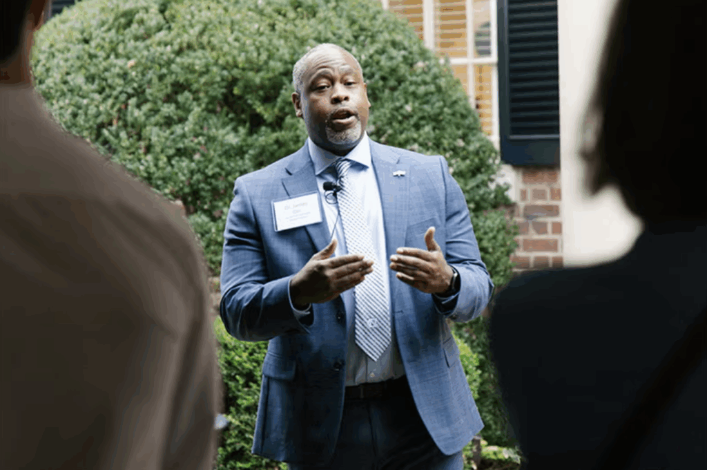 a man in a suit, talking