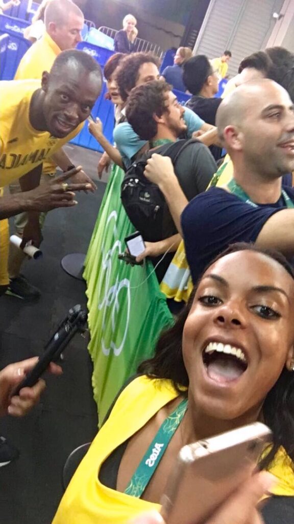 a selfie of a woman with Usain Bolt