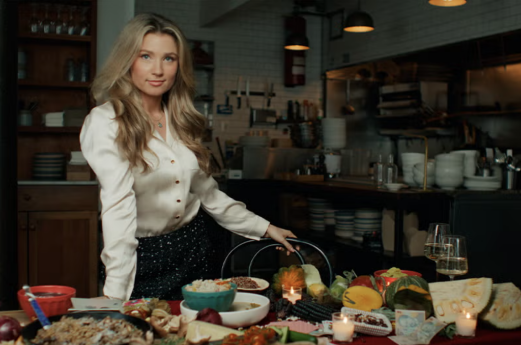 Anne Marie Hagerty in front of a table of food