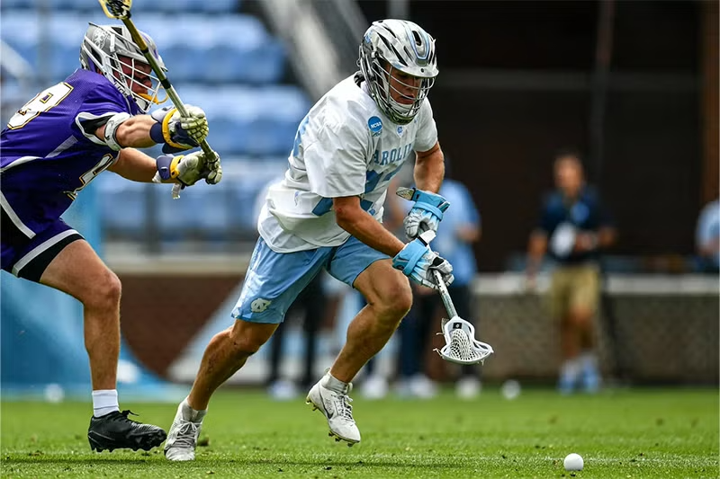A person playing lacrosse.