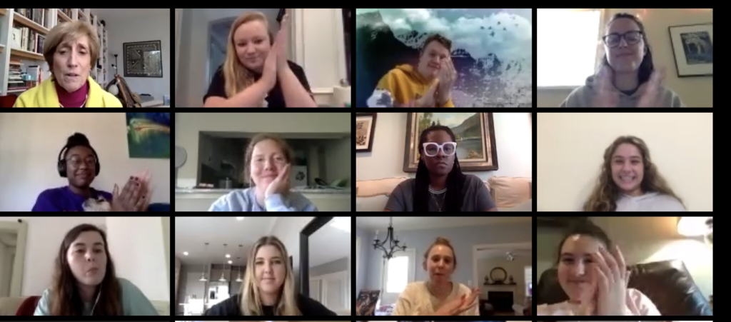 a screenshot of a group of students clapping their hands with a professor on a Zoom call